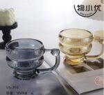 (ON SALES) 350ML CLASSY QUALITY MILK,SMOOTHIE,COFFEE GLASS CUP WITH HANDLE Design 1 

Color we’ve seen so far is Gold and Black for now - Image 3