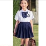 CHLOE WHITE SHIRT,BOW TIE AND BLACK SKIRT