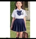 CHLOE WHITE SHIRT,BOW TIE AND BLACK SKIRT